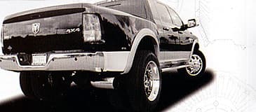 Rear three-quarter dually truck from the Diesel Wheels Premier Series catalog spread