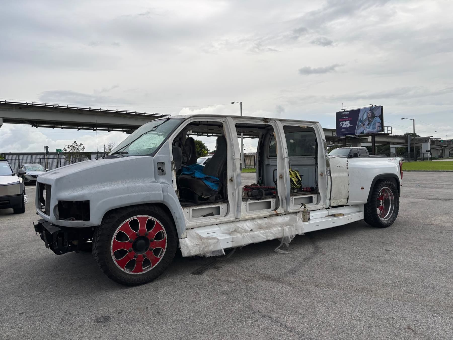 White Chevy dually project truck side profile during fitment work